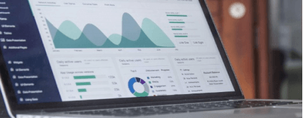 A laptop with a statistics dashboard on the screen